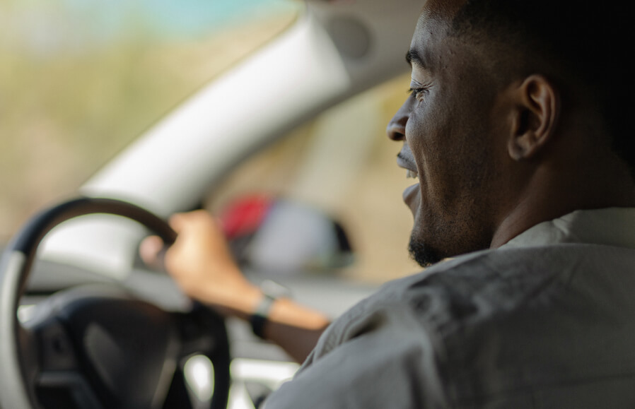 Man at wheel of car